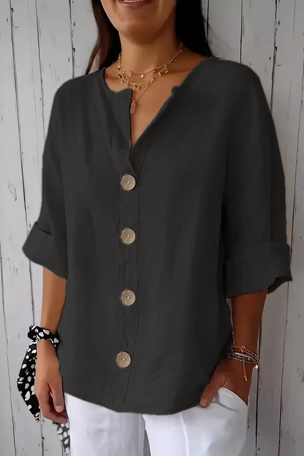 Solid color, loosely buttoned V-neck top