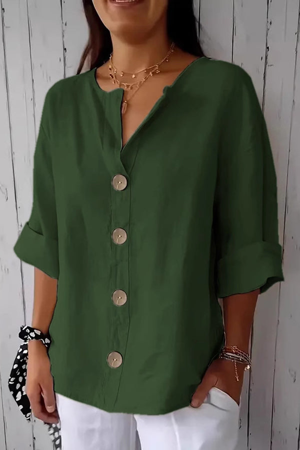 Solid color, loosely buttoned V-neck top