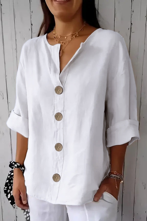 Solid color, loosely buttoned V-neck top