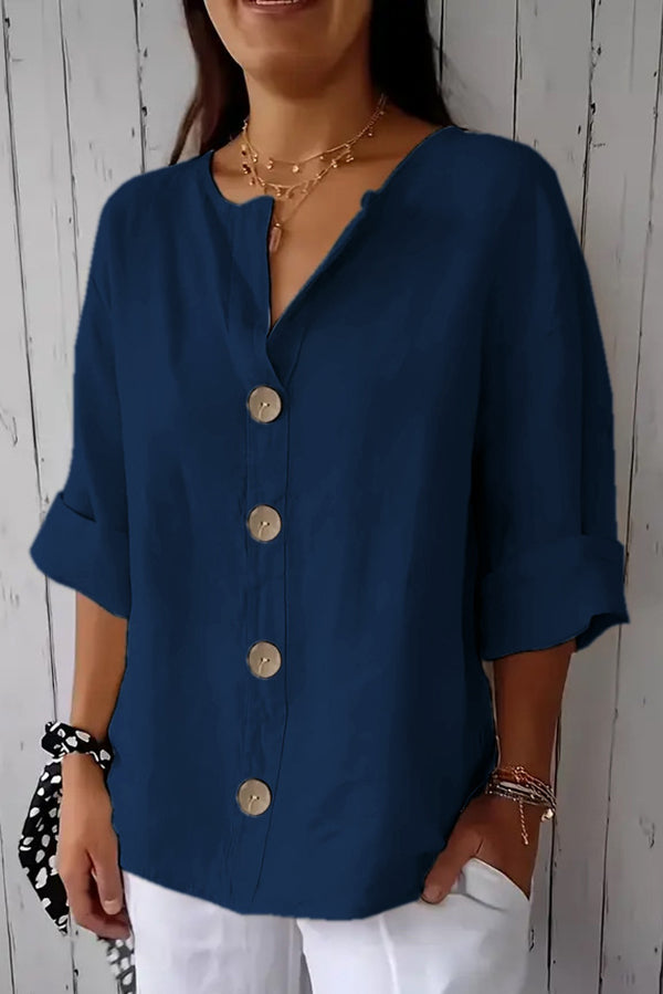 Solid color, loosely buttoned V-neck top